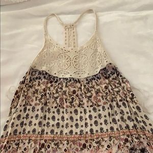 Tank top with thin straps.